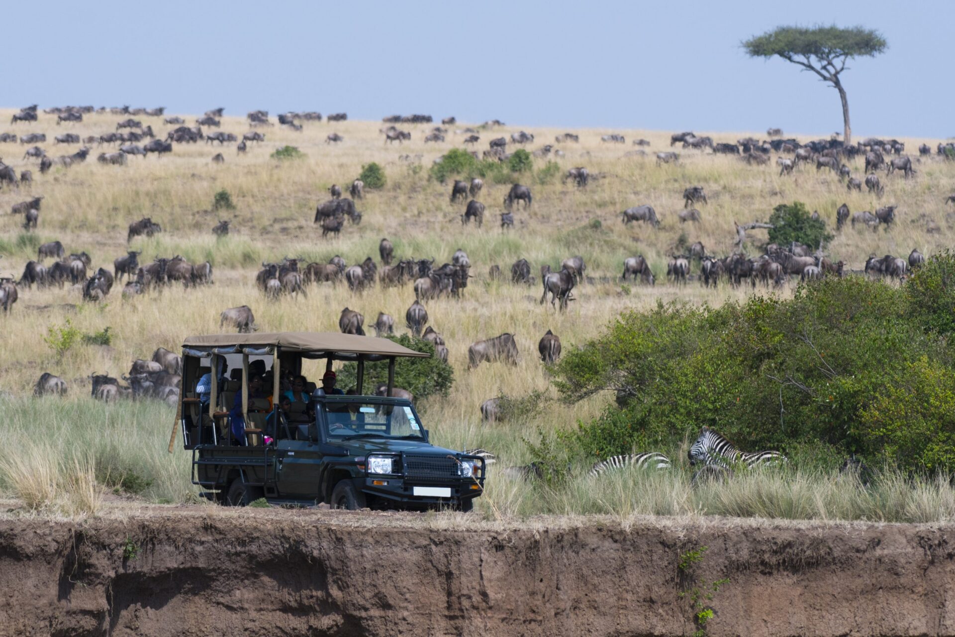 A safari vehicle in the Masai Mara National Reserve, Kenya, Africa