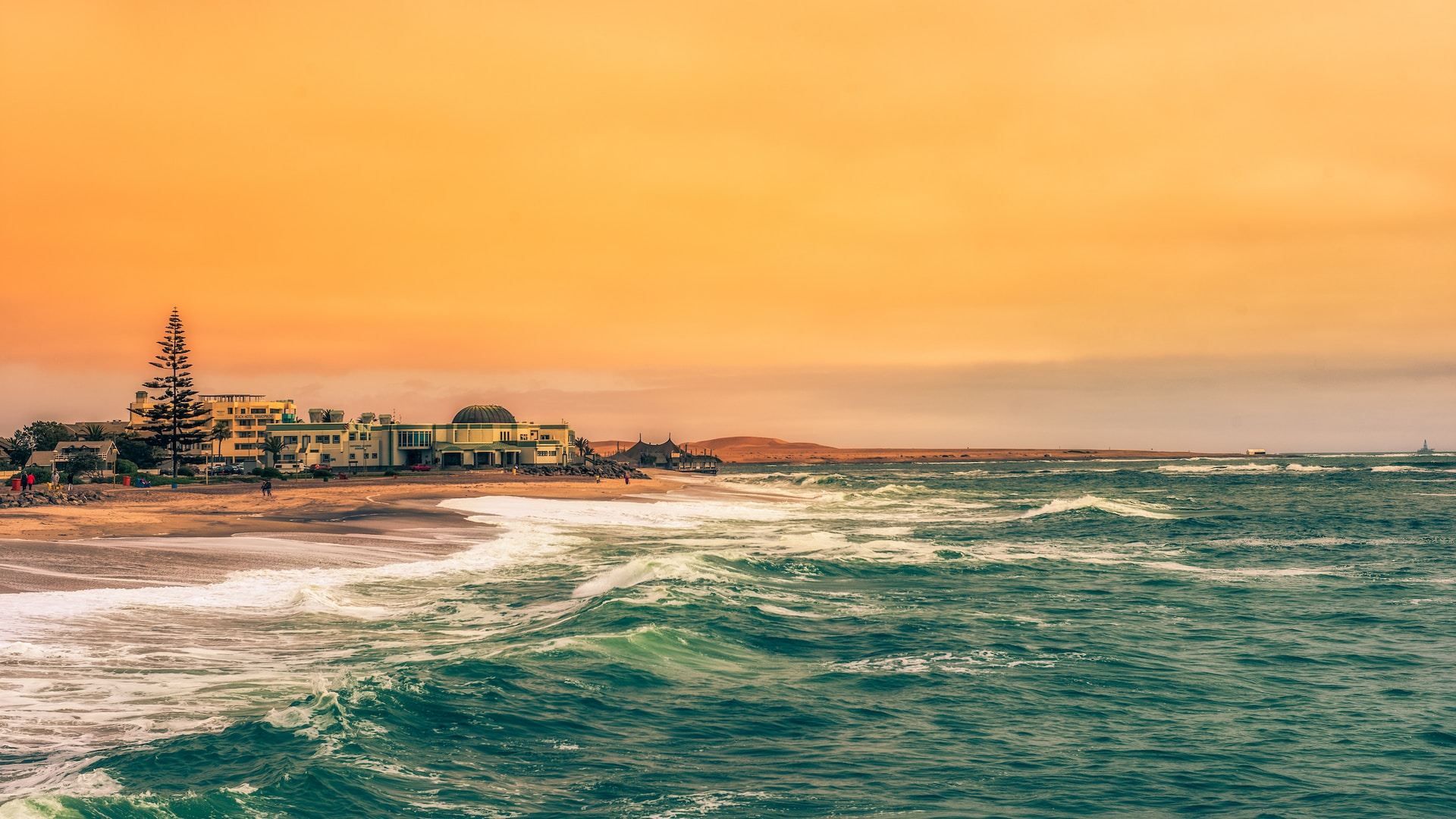 View of Swakopmund in the evening light with coastline and waves