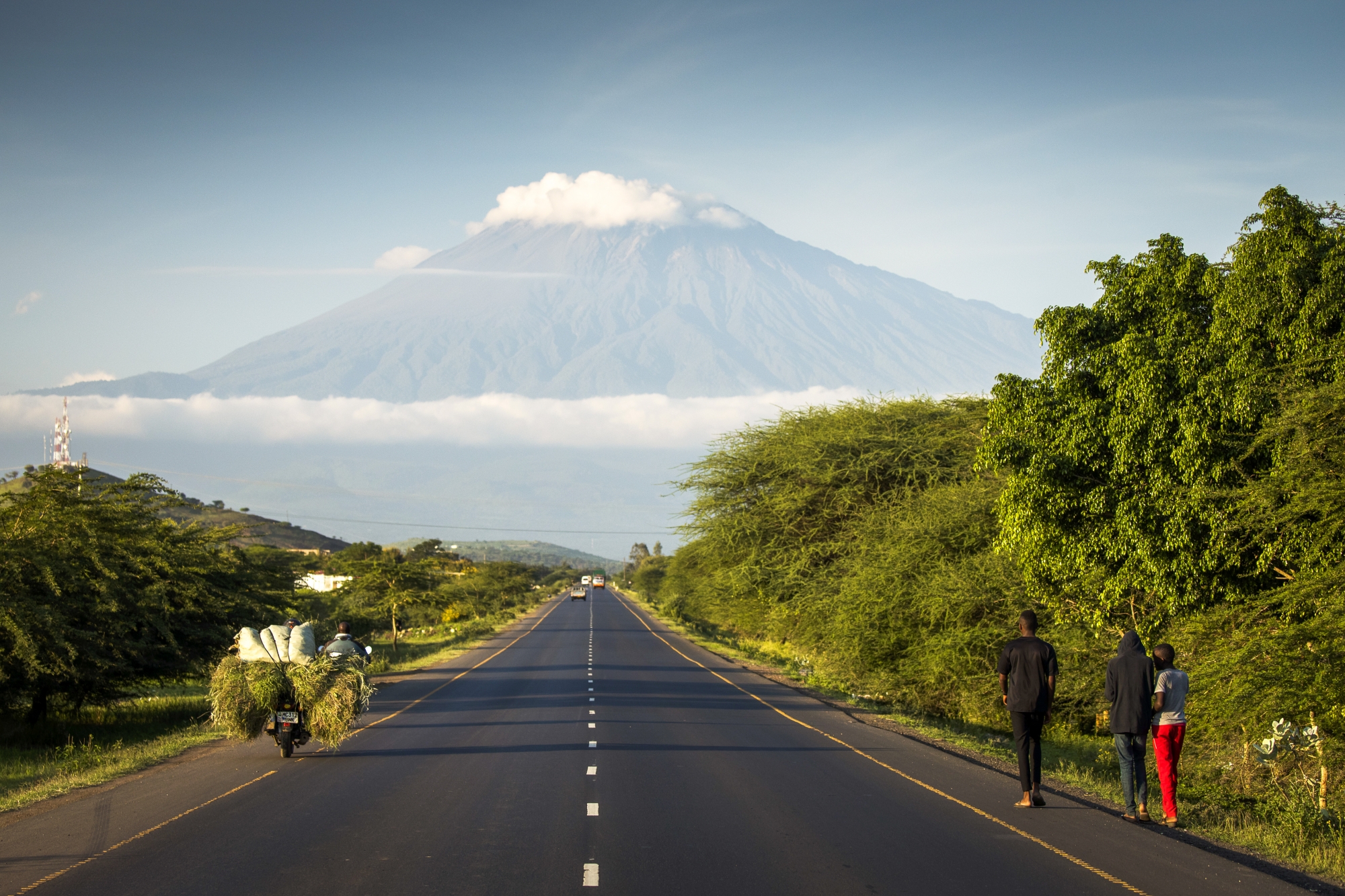 A road with Mount Meru in background, Tanzania.